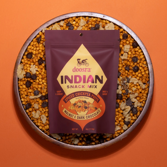 Doosra Indian Snack Mix package on a plate of snack mix against an orange background