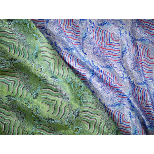 Two emperor cloud motif brocade fabric. One in green, the other in purple