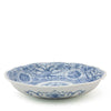 Blue and white ceramic bowl with floral pattern on a white background