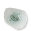 A small handmade ceramic dish with a rough, organic shape, featuring a glossy white glaze with subtle gray-green speckles and a textured, leaf-like pattern on the interior, shown on a plain white background.