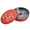 Red lid with floral design on lid and metal tray inside