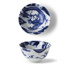 Blue and white ceramic bowl with dragon design on a white background