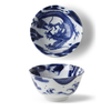 Blue and white ceramic bowl with dragon design on a white background