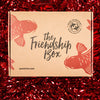 Friendship Box closed on red tinsel