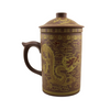 Red-brown mug with dragon design on a white background