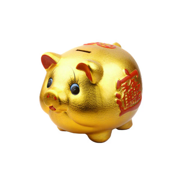 Golden colored piggy bank with red character stamped on its side