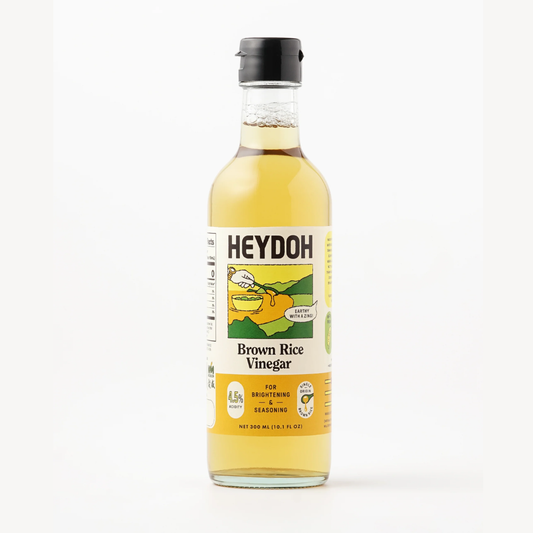 Bottle of Heydoh Brown Rice Vinegar on a white background