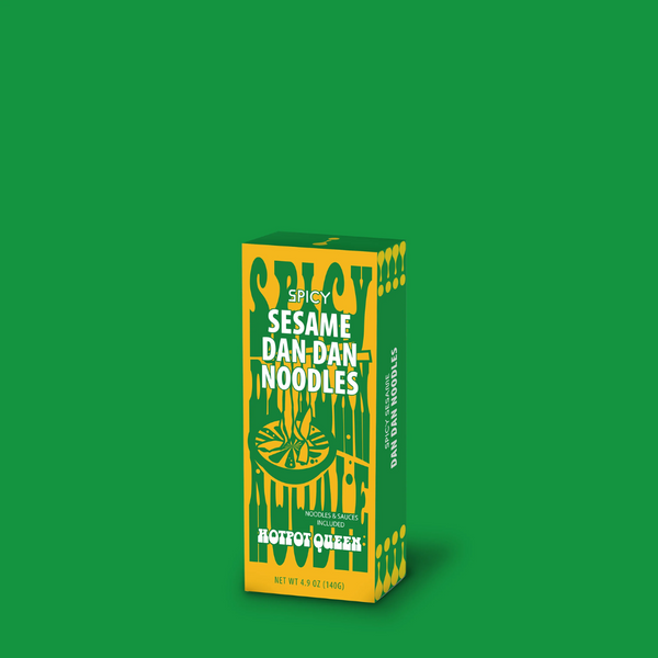 Box of Spicy Sesame Dan Dan Noodles on a green background