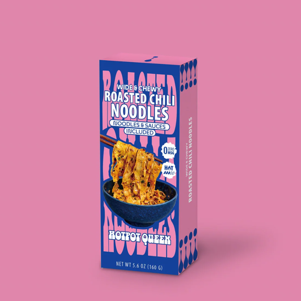 Box of roasted chili noodles on a pink background