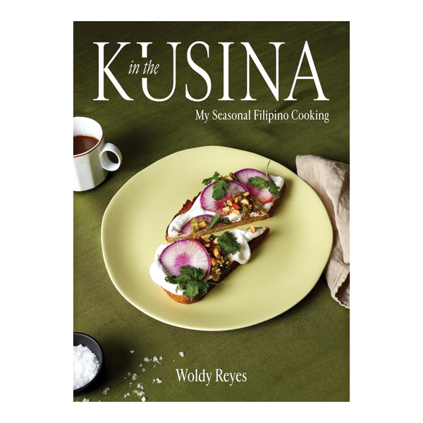 Book cover of 'In the Kusina' with a dish and cup on a green background