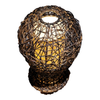 Woven rattan lantern with a warm glow on a white background