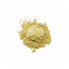 Pile of light green powder on a white background