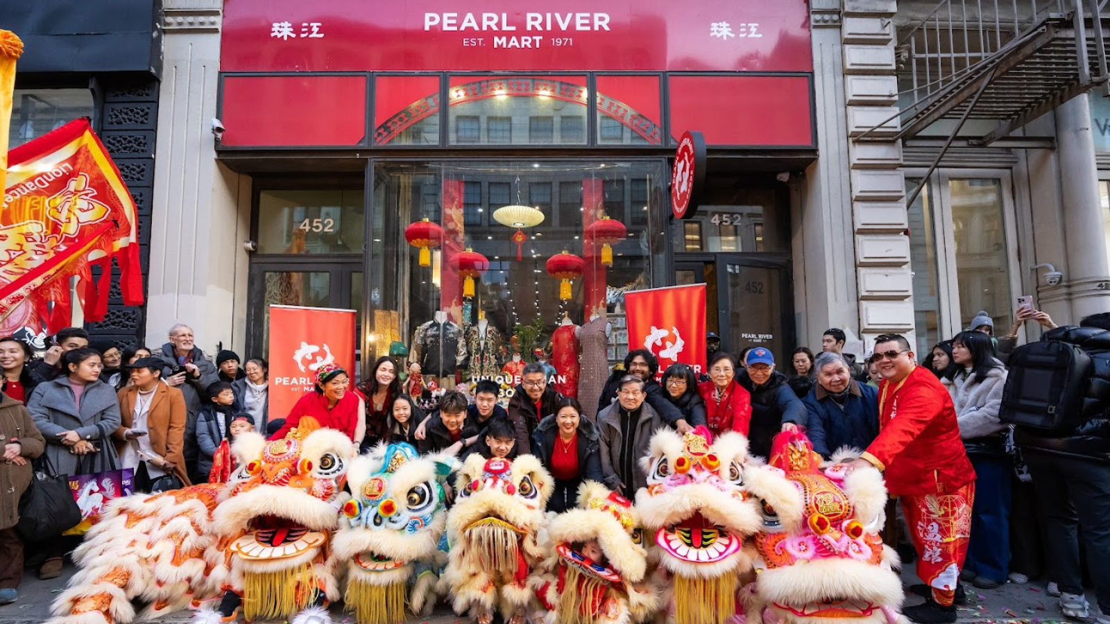 Iion dancers on a platform outside of Pearl River Mart