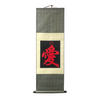 Hanging scroll with red calligraphy on a white background