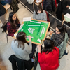 Group of people playing mahjong.