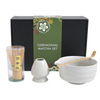 Ceremonial matcha set with bowl, whisk, and container in front of a green box labeled 'Ceremonial Matcha Set'.