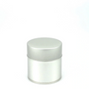 Silver cylindrical container with lid on a white background