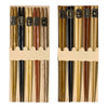 Two wooden chopstick sets, each with black and natural wood sticks and small black labels with gold characters.
