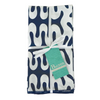 Folded blue and white patterned napkin set with a tag