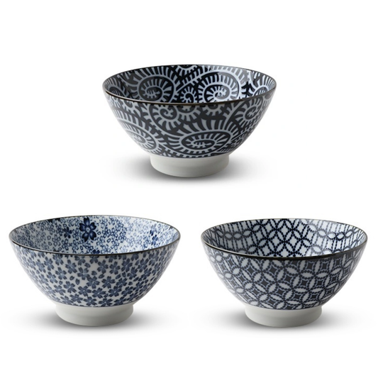 Three ceramic bowls with blue and white patterns on a white background