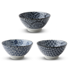 Three ceramic bowls with blue and white patterns on a white background