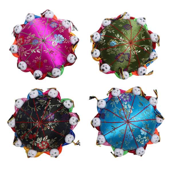 Four Chinese style pin cushions in various colors