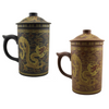 Two ceramic mugs with dragon designs on a white background