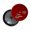 Red lid with fish design on a black circular tray