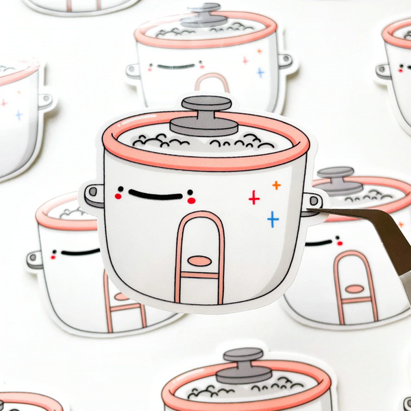 Rice Cooker Sticker that has a smiley face