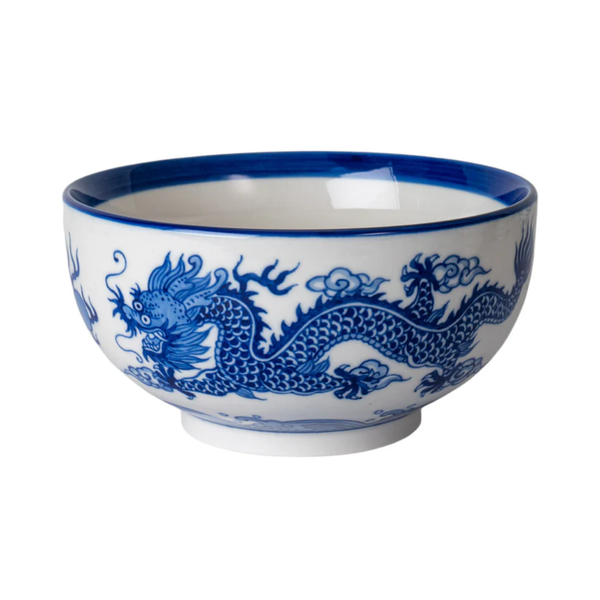 Ceramic bowl with blue dragon design on a white background