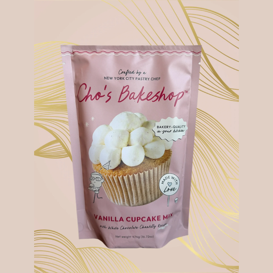 Vanilla cupcake mix package with pink background and gold decorative elements