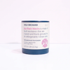 Wild Orchard Jeju Black Matcha organic black tea powder in a cylindrical white jar with a dark blue lid and base, set against a plain white background.