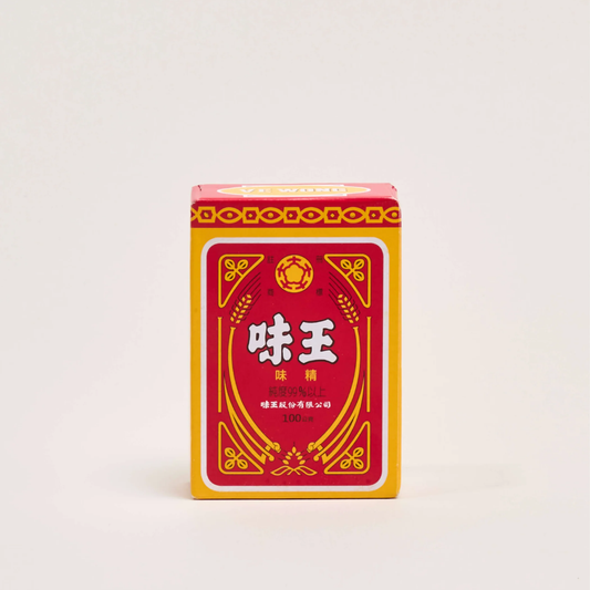 A red and yellow rectangular box of Chinese food flavoring powder, featuring the brand name '愈奇' in white Chinese characters, set against a plain light gray background.