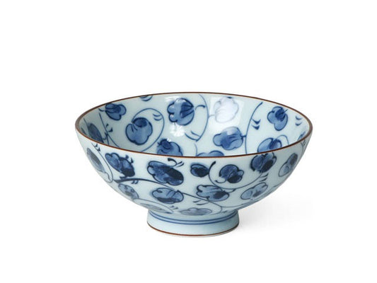 A modern white rice bowl with a Karasuka vine of blue flowers