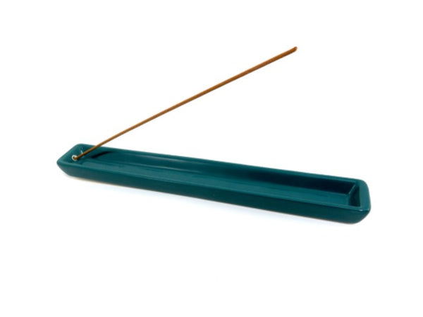 Blue-green ceramic incense tray holding an incense