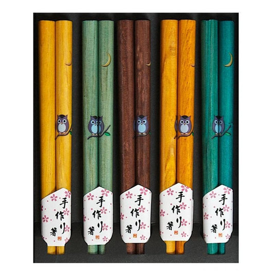 A set of five wooden chopsticks in 
assorted colors, including yellow, green, brown, and teal