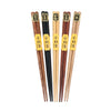 Five pairs of natural wood color hexagonal chopsticks in assorted colors.