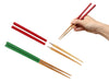 Collapsible chopsticks in red and green with hand holding red pair