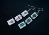 Mixed pair mahjong earrings on black background