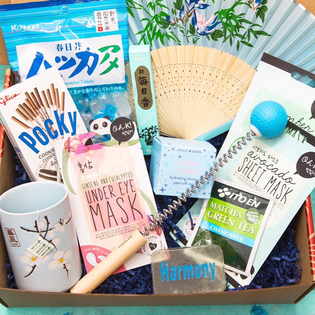 Friendship Box with mint candy, Pocky, tea cup, K-beauty sheet masks, fan, handheld massager, soap
