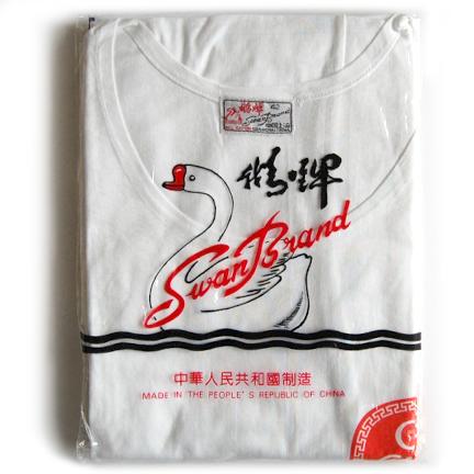 Iconic white tee folded in Swan Brand's classic packaging