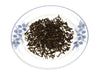 Loose Yunnan Pu-Erh Black Tea on plate.
