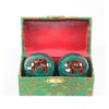 Two blue green Cloisonné metal therapy balls. Each having an elephant design on them