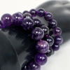 Three purple stone beaded bracelets