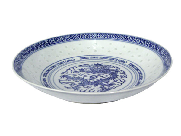 A vintage white deep plate with dark blue accents around a powerful dragon perfect for any meal