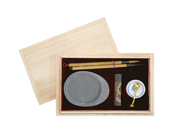 Calligraphy set in wooden box with brushes, ink stone, chop, dish, spoon
