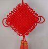 Red braided giant diamond knot ornament. Tassels shown as well