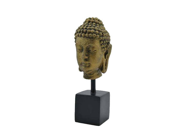 Buddha head made of resin on a stand