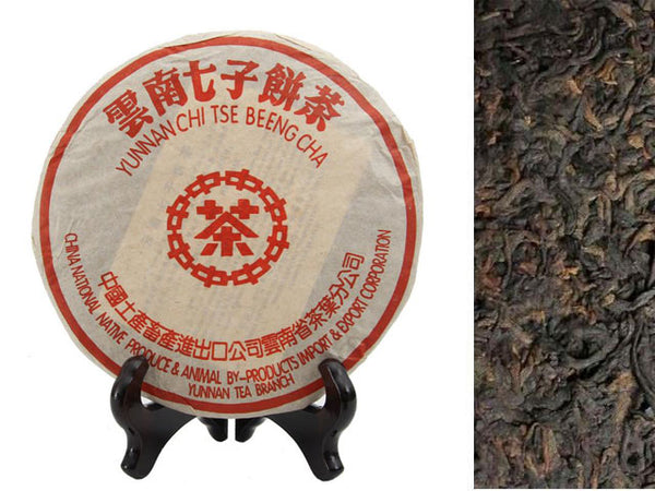 Yunnan Chi Tse Pu Erh Compressed tea on a stand. Next to Yunnan loose tea