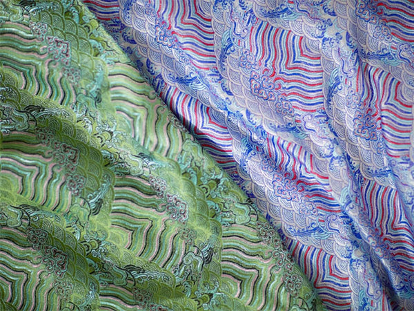 Two emperor cloud motif brocade fabric. One in green, the other in purple